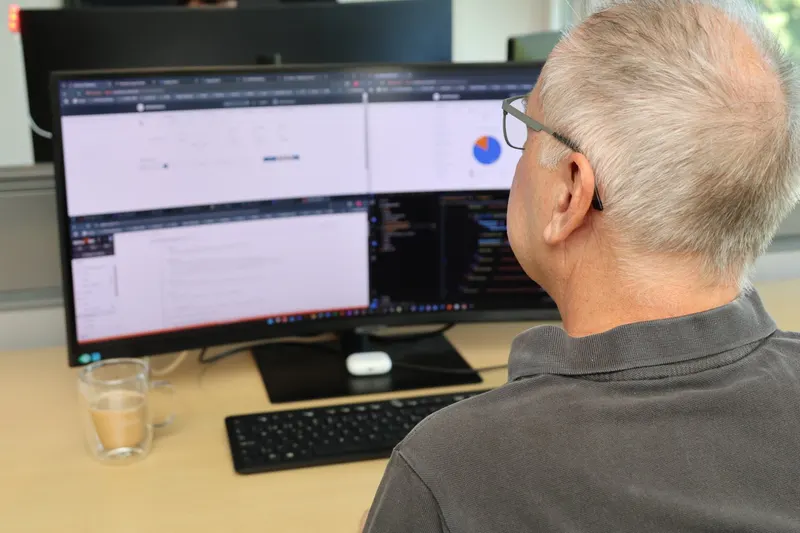 An engineer reading charts on screen