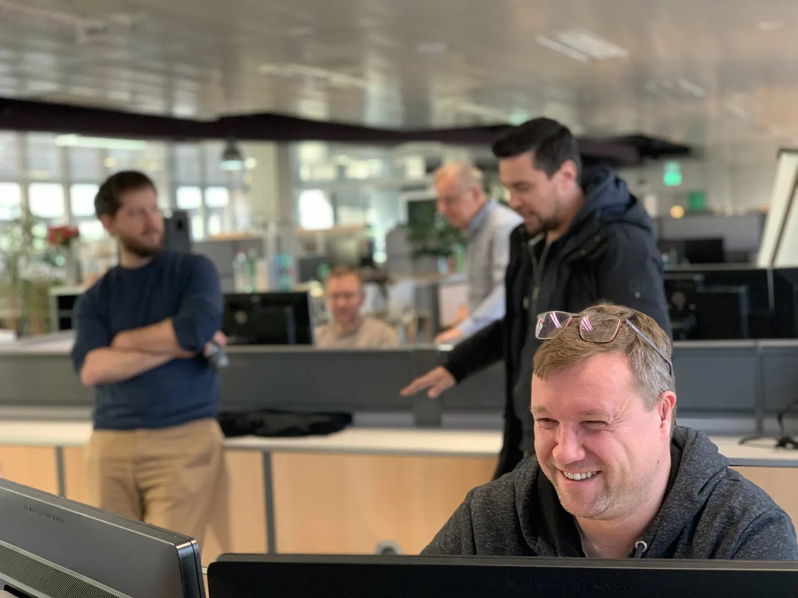 The soulTec office in Dübendorf, several engineers at their desks