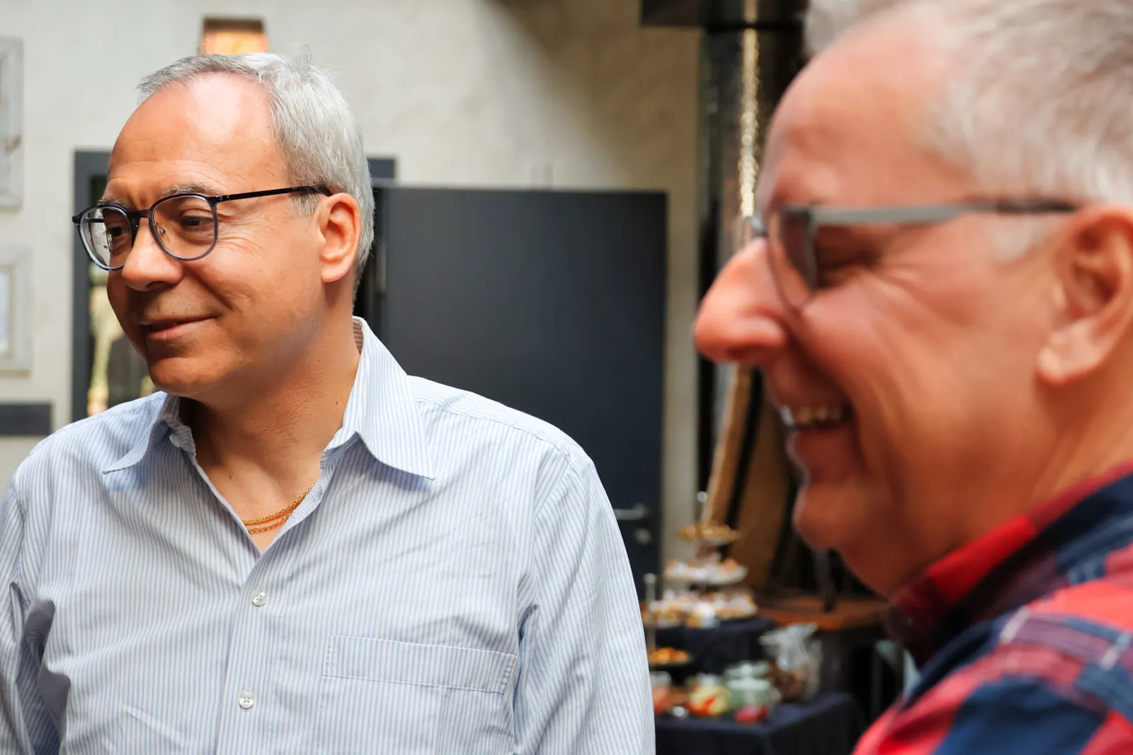 Two colleagues laughing